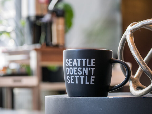 A black mug on a table with 